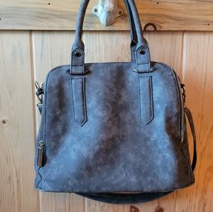 Gray blue travel bag with three zip compartments.